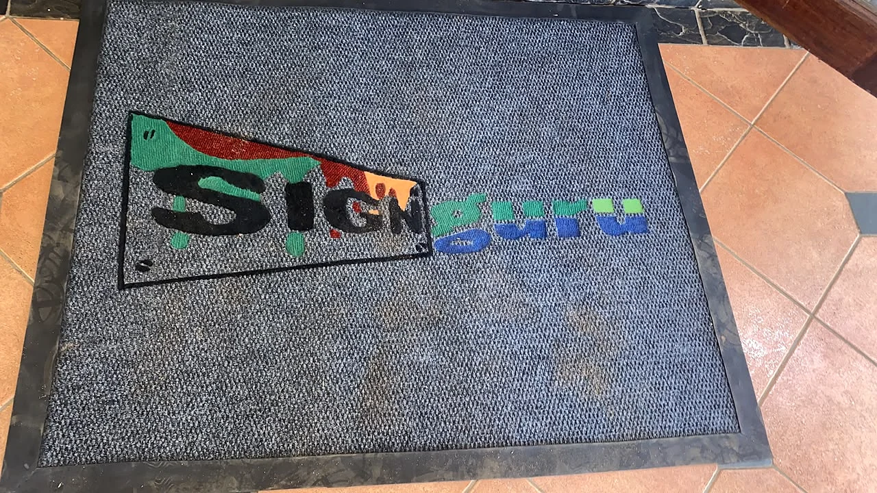 Sign Guru branded floor mat shown in readable landscape orientation