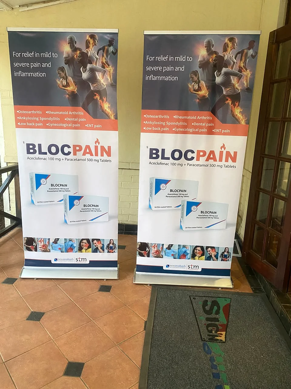 BlocPain branded roll-up banners